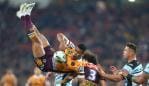 BRISBANE, AUSTRALIA - JULY 26: Jamayne Isaako of the Broncos is tackled in the air during the round 20 NRL match between the Brisbane Broncos and the Cronulla Sharks at Suncorp Stadium on July 26, 2018 in Brisbane, Australia. (Photo by Chris Hyde/Getty Images)