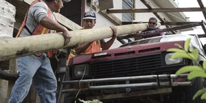 Puerto Ricans grab machetes, shovels to help restore power