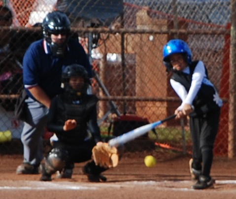 fastpitch softball hitter hitting